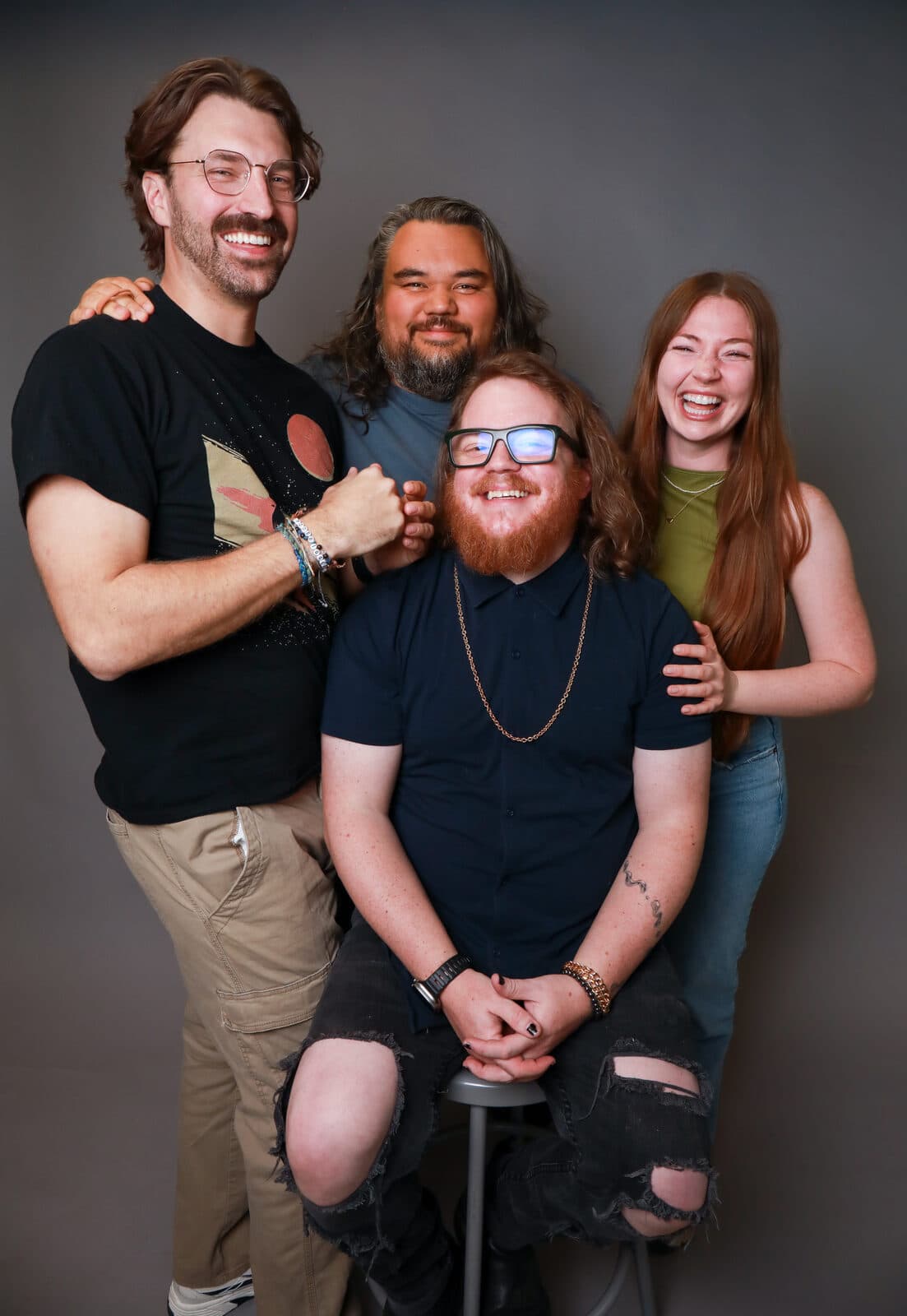 The four members of Musical Monday laughing together